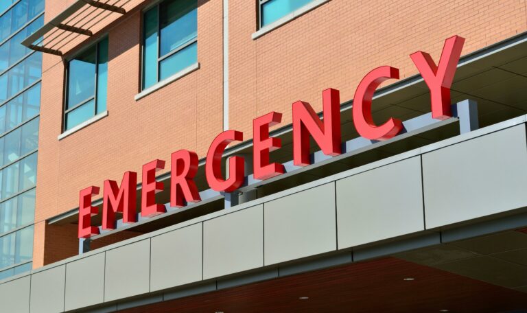Security guard outside Sacramento emergency room ensuring patient and staff safety